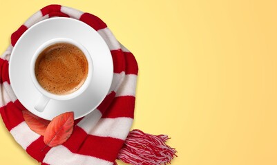 Wall Mural - Autumn concept. Cup of drink and scarf on the desk