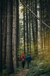 © andrii_popovych - Young Couple Walking into the Pine Forest