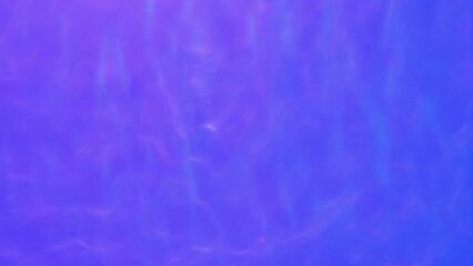Wall Mural - Neon Blue, pink and purple Water gradient texture with drops, splashes and waves. Organic water toned in blue and pink gradient with refraction of light slow motion video banner.