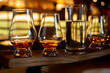 © barmalini - Flight of single malt scotch whisky in glasses served in whiskey bar in Edinburgh, UK