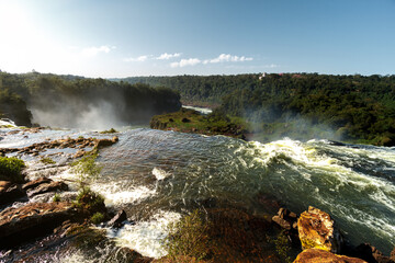 Wall Mural - River stream before falling down a waterfall at Iguazu Falls, Argentina