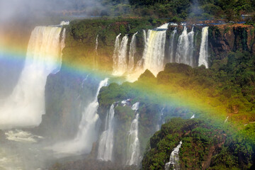 Wall Mural - Iguazu Falls with rainbow crossed in the foreground