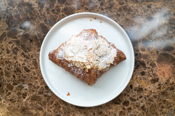 Sticker - almonds cream croissant on plate