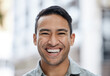 © S Fanti/peopleimages.com - Happy, smile and face portrait of a man with a vision, mindset and motivation for success. Young entrepreneur or corporate professional businessman smiling in happiness over city street background.