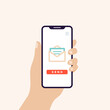 © frikota - Hand holding smart phone in vertical position banner. Screen with open email icon and send button. Vector illustration, flat design