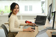 © Prathankarnpap - Image of female video editor working with footage and post production montage in creative office studio