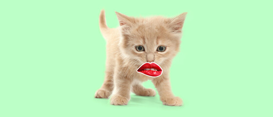 Sticker - Funny kitten with red human lips on green background