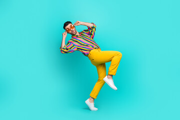 Wall Mural - Side profile full length size photo of funky pouted lips guy wear vintage shirt walk tiptoe quiet from discotheque isolated on cyan color background