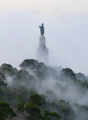 Aufkleber - The Mist Covers The Sculpture Of The Christ The King Monument In The Santuaio De Sant Salvador