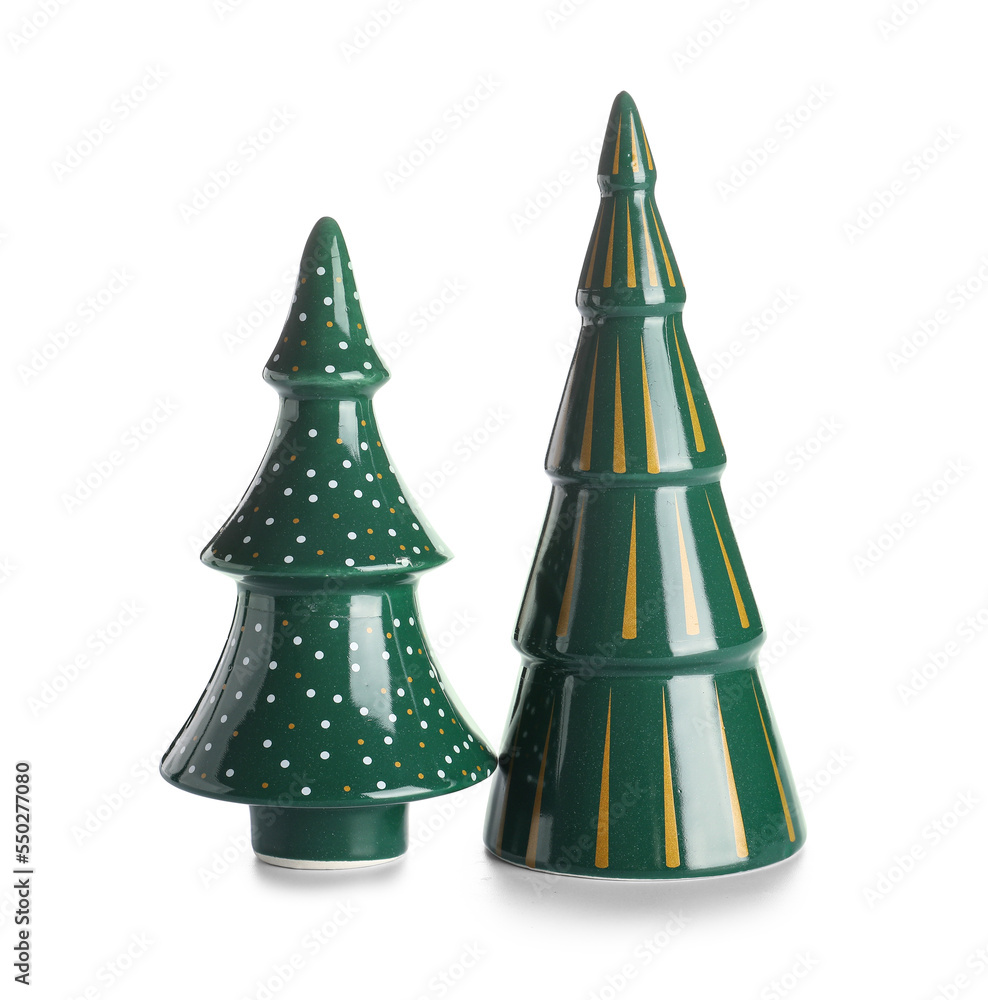 Ceramic Christmas trees on white background