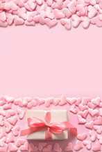 Valentine Day Or Newborn Girly Gift And Pink Hearts On Pink Background. Greeting Card With Copy Space.