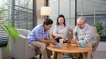 Wall Mural - Group of elderly people enjoy talking , relaxing with game at  senior healthcare center.