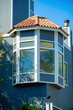 Turret or spire tower with white accent details and blue or gray wooden exterior of house or home in san francisco california