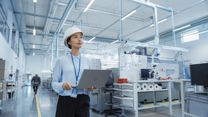 Leinwandbilder - Portrait of an Asian Female Engineer in Hard Hat Standing and Using Laptop Computer at Electronic Manufacturing Factory. Technician Thinking About Daily Tasks and Working on Development Data.