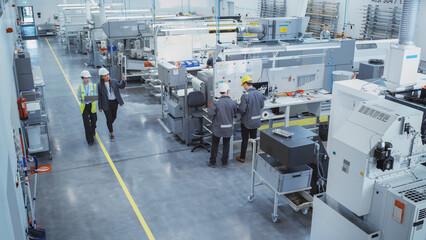 Aufkleber - Industrial Factory: Diverse Multiethnic Team of Engineers, Technicians, Specialists and Workers, Working on Production Plant, Developing CNC Parts, Programming Machines, Executing Orders.