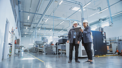 Aufkleber - Portrait of Two Heavy Industry Employees in Hard Hats at Factory. Checking and Discussing Industrial Facility, Using Tablet Computer. African American Engineer and Middle Aged Technician at Work.