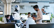 © ihorvsn - Indian man speaking to robot in office. Male developer checking work and moves of cyborg. Coworking space. Humanoid moving and executing instructions and orders. Artificial intelligence Startup.