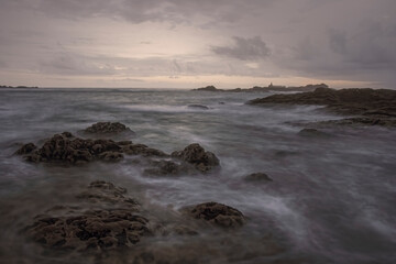 Wall Mural - Rocky beach at sunset or dusk