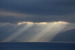 © Sergei Timofeev - the sun rays shine through the clouds on the sea surface