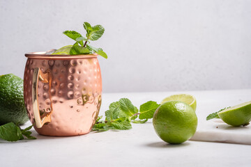 Wall Mural - Moscow mule alcoholic cocktail in copper mug with lime, mint and cucumber