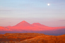 The Full Moon Rising Above The Famous Valley Of The Moon / Valle De La Luna Near San Pedro De Atacama, Chile.