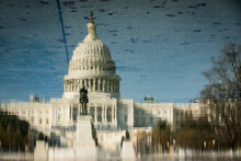 Mirrored Reflection Of The Capitol Building, Washington DC