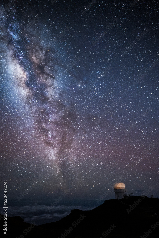 The Milky Way and stars at night over the observatory at Mt. Haleakala ...