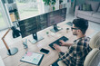 © deagreez - Photo of handsome cool guy wear glasses creating new start up modern device indoors workstation workshop home