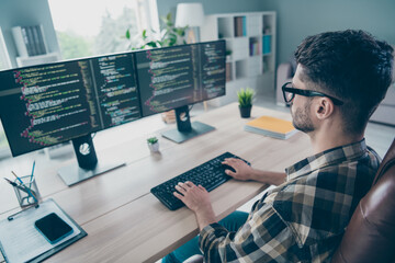 Photo of busy confident guy wear glasses typing keyboard modern device indoors workstation workshop home