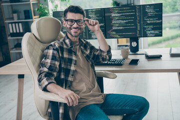 Portrait of intelligent pc operator sitting chair hand touch eyewear network security open space indoors