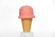 Toy Pink Ice Cream In A Cone On A Top Of Table