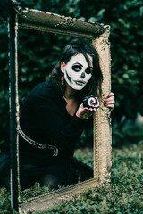 Sticker - Serbian woman wearing a skeleton face during Halloween