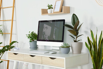 Sticker - Comfortable workplace with modern computer and different houseplants in room