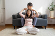 © bennnn - Asian brother and sister hugging with care and love sit on sofa at home.