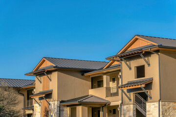 Austin, Texas- Brown schemed apartment building with window canopies