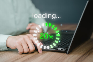Man using laptop for download software and waiting to loading digital business data form website, concept of waiting for load of loading bar.