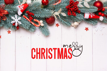 Wall Mural - Merry Christmas greeting card with composition made from pine tree, stars and festive decorations top view