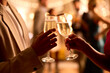 © Monkey Business - Close Up Of Couple At Party Making Champagne Toast Together