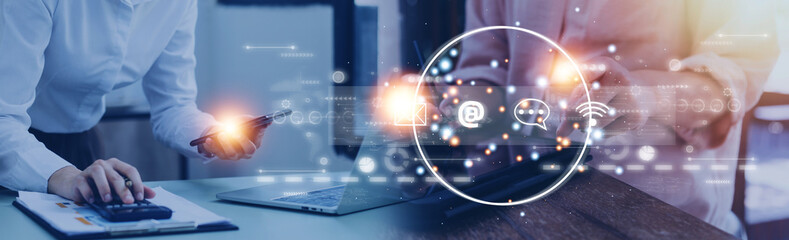 Contact us or Customer support hotline people connect. Businessman using a laptop and touching on virtual screen contact icons email, address, live chat, internet wifi.
