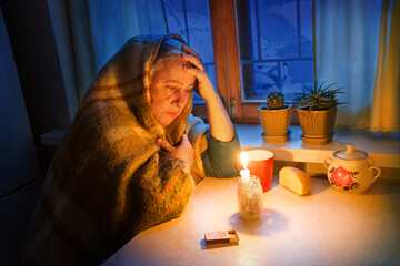 Woman with candles. Power outage in Kyiv