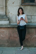 © andriyyavor - Happy beautiful young Caucasian girl with smart phone outdoors on sunny summer day texting and smiling