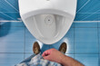 Man stands in front of toilet in toilet and tries to urinate. First-person view. Urinary problem and male disease prostatitis..