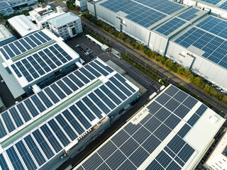 Wall Mural - Aerial view of solar panels installed on factory rooftop