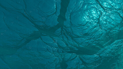 view under the sea with bubbles. underwater view of a choppy turquoise sea. undersea background with sun reflection and bubbles