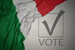 waving colorful national flag of italy on a gray background with text vote. 3D illustration