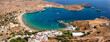 Lindos small whitewashed village and the Acropolis, scenery of Rhodos Island at Aegean Sea, Rhodes, Greece. Lindos bay, village and Acropolis, Rhodes, Greece