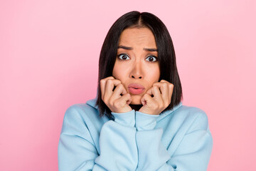 Poster - Photo portrait of lovely young lady concerned arms touch cheeks frightened worried wear trendy blue look isolated on pink color background