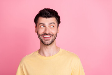 Sticker - Photo of handsome good mood positive guy with brunet hair dressed yellow t-shirt look empty space isolated on pink color background