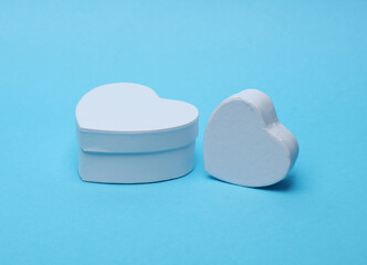 Poster - White heart shaped gift boxes mockup isolated on blue background.