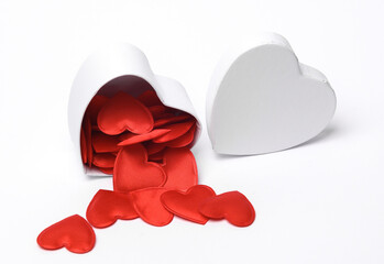 Wall Mural - White heart shaped gift boxes with red hearts isolated on white background. Top view